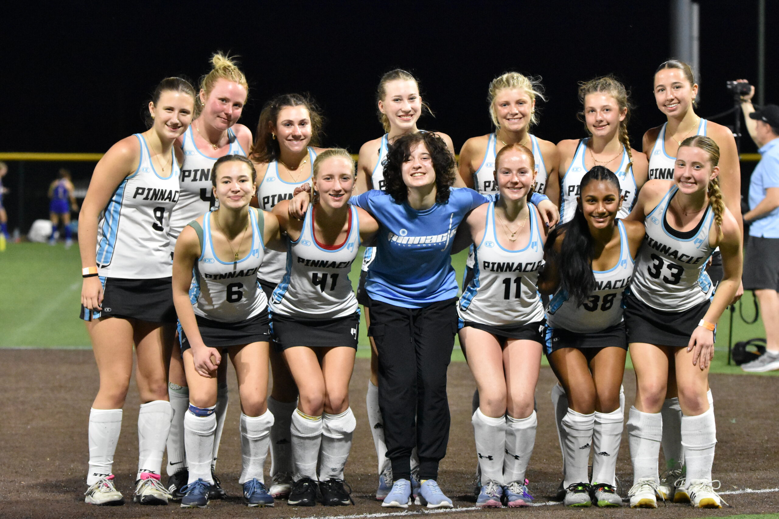 a group of pinnacle field hockey players