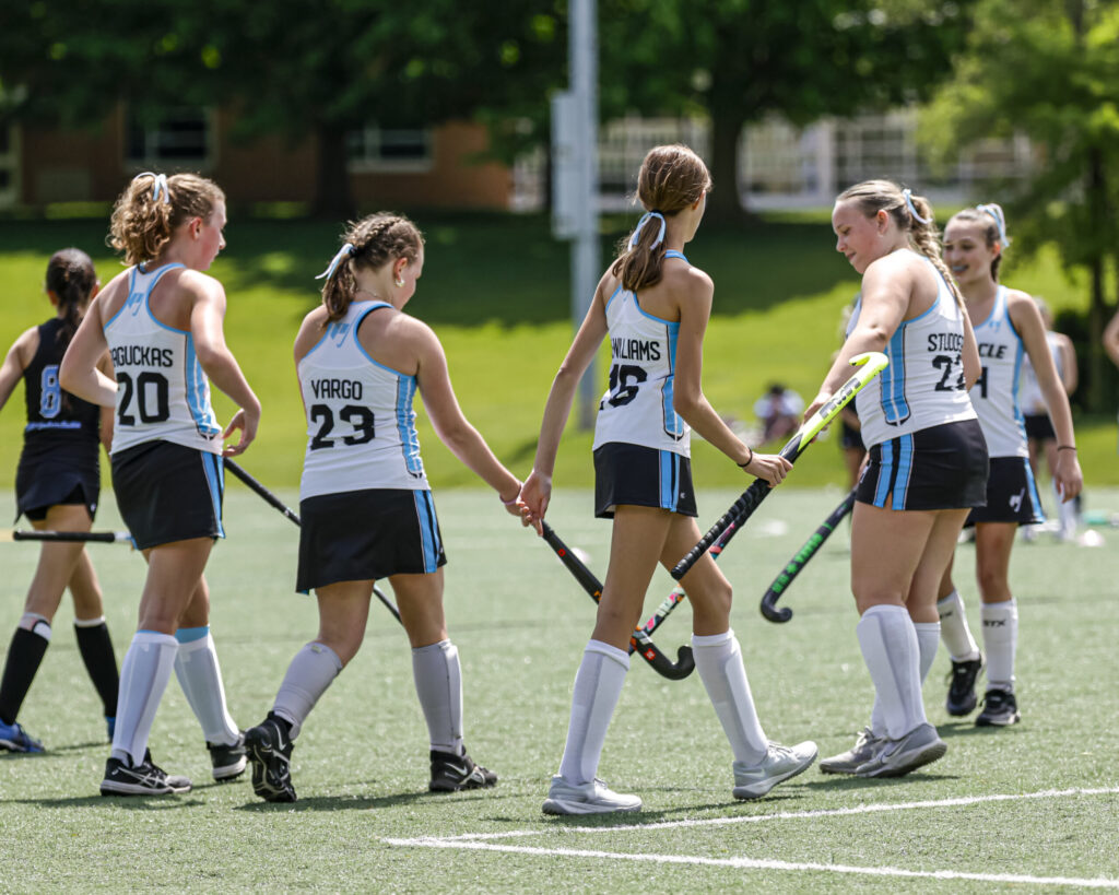group of youth field hockey players from michigan team