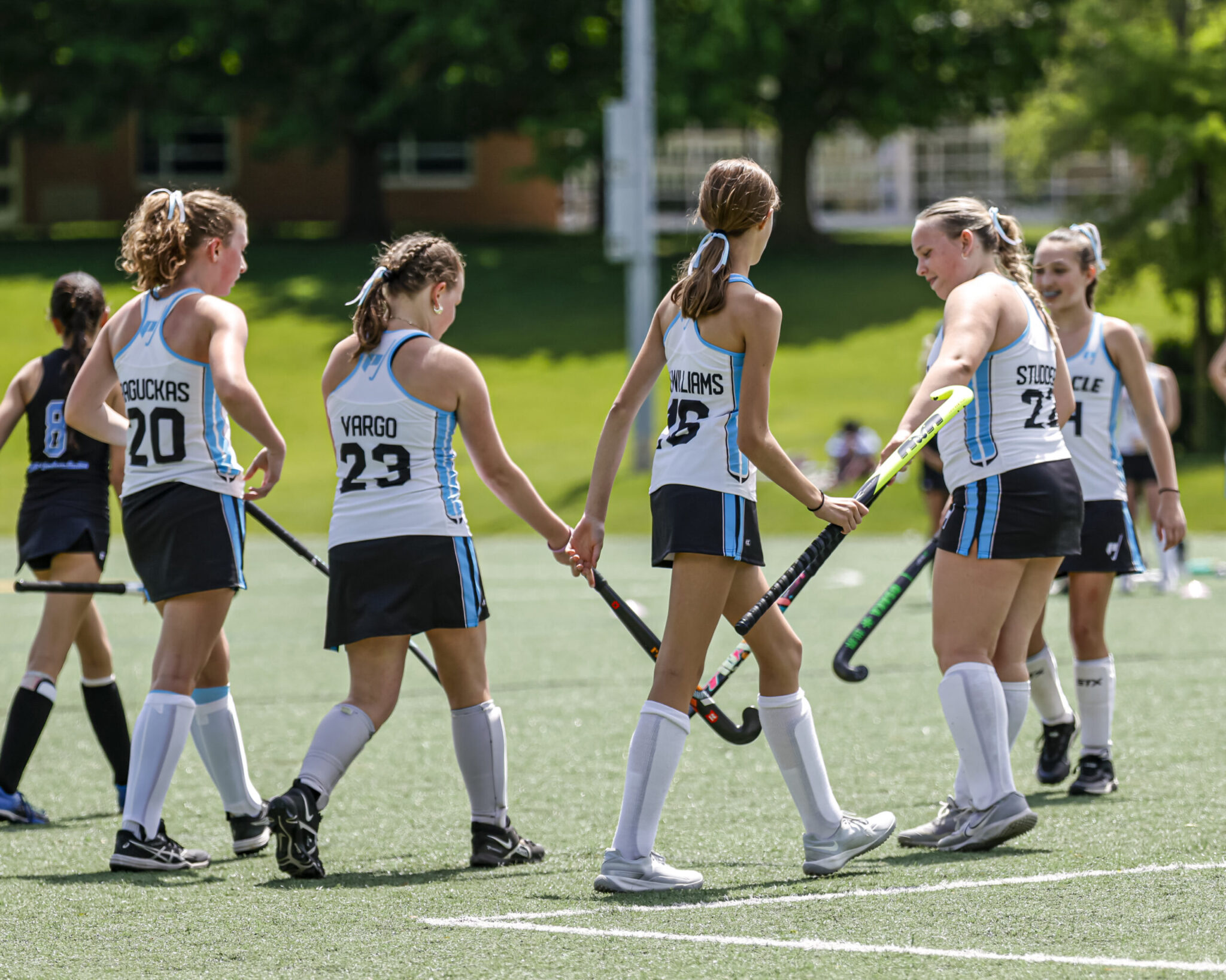 group of youth field hockey players from michigan team
